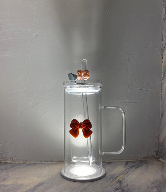 Aesthetic glass tumbler with pink bow.